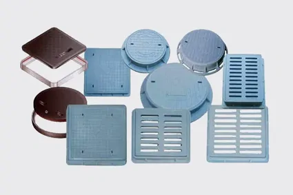 Polymer-sand manhole covers and grates